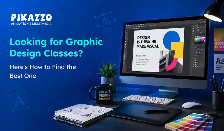 Workspace with a computer displaying graphic design software, sketchbook, color swatches, and text promoting graphic design classes.